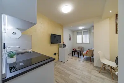 a kitchen with a sink and a counter top at Kapetan apartman in Belgrade