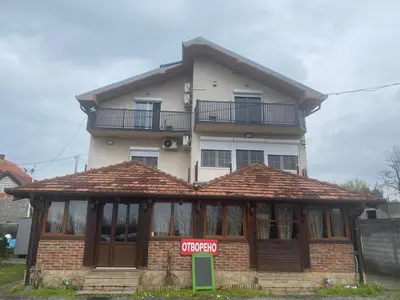 a building with a sign in front of it at Apartmani Amon in Meljak