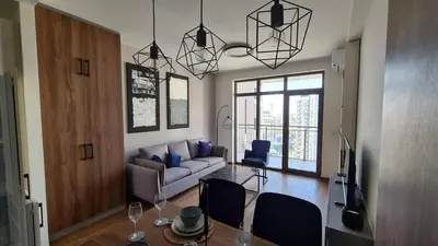 a living room with a couch and a glass table at Bw Sky View3,Belgrade Waterfront in Belgrade