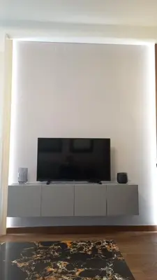 a living room with a flat screen tv on a white wall at Bw Sky View3,Belgrade Waterfront in Belgrade