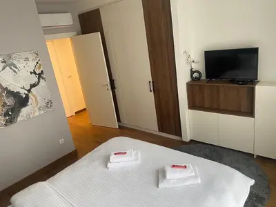 a room with a bed with two white towels at Bw Sky View3,Belgrade Waterfront in Belgrade