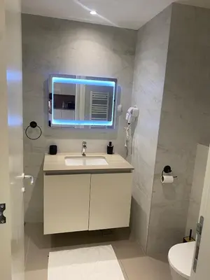 a bathroom with a sink and a mirror at Bw Sky View3,Belgrade Waterfront in Belgrade