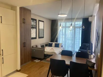 a living room with a table and a couch at Bw Sky View3,Belgrade Waterfront in Belgrade