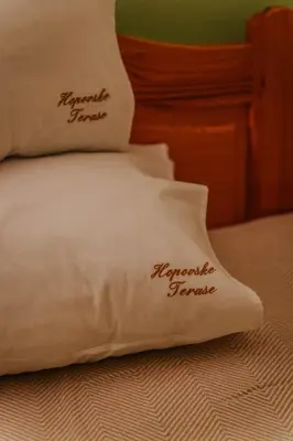 two pillows on a bed with the words republicgamer at Hopovske Terase in Irig