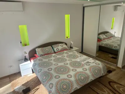 a bedroom with a bed and a large mirror at Fontana in Belgrade