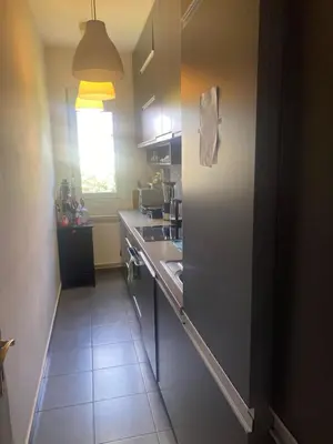 a kitchen with a sink and a counter top at Apartman Lux in Belgrade