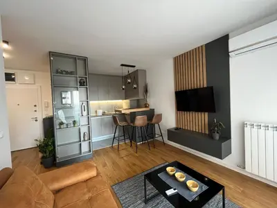 a living room with a couch and a table at Sunnyhome in Belgrade