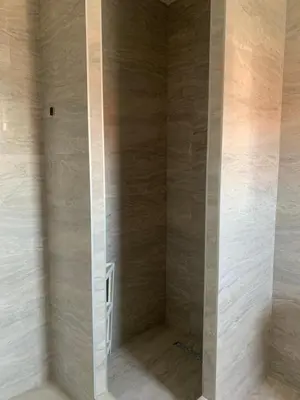 a bathroom with a shower with marble walls at Belgrade Airport Luxury Single in Surčin