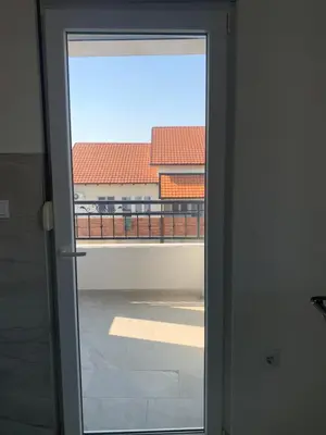 an open door with a view of a balcony at Belgrade Airport Luxury single bed in Surčin