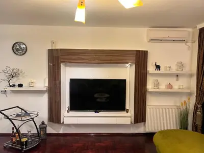 a living room with a large flat screen tv at Mona Lux apartman in Arandjelovac