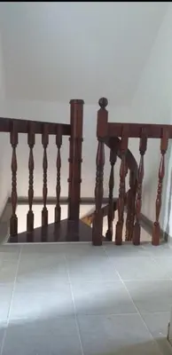 a wooden bench sitting on top of a floor at Vila Restart Čortanovci in Čortanovci