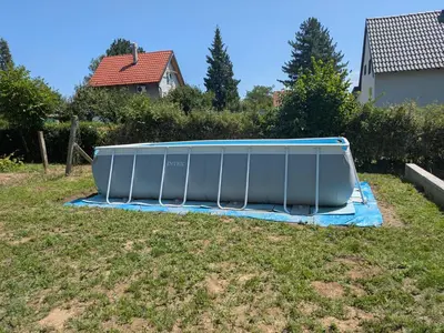 an infront of a house with a tank on the grass at Vila Restart Čortanovci in Čortanovci