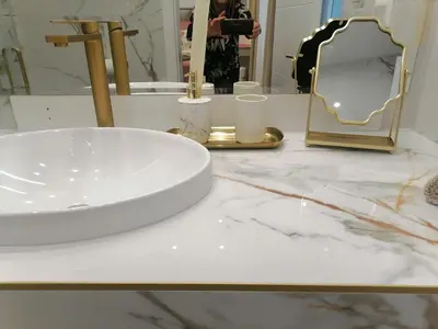 a bathroom with a sink and a mirror on a counter at Luxi TOP in Belgrade