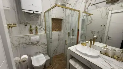 a bathroom with a toilet and a sink and a shower at Luxi TOP in Belgrade