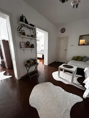 a living room with a bed and a table at Hyde park apartments in Belgrade