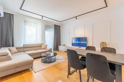 a living room with a couch and a table at Park Vila Apartments in Belgrade