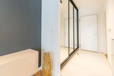 a room with a mirror and a leopard chair at Park Vila Apartments in Belgrade