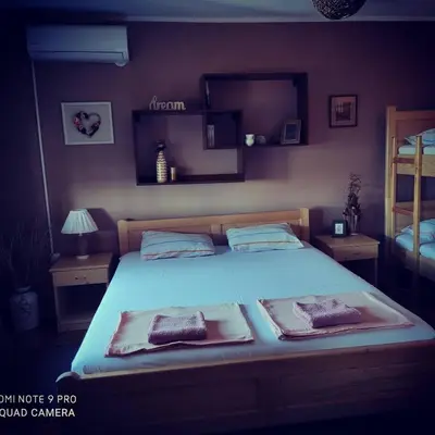 a bedroom with a bed with two pillows on it at HostelChe Guest House in Smederevo