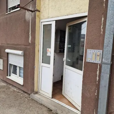 an entrance to a building with a white door at iDoli Stan in Belgrade