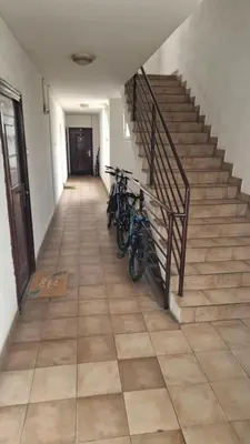 two bikes parked in a hallway with stairs at iDoli Stan in Belgrade
