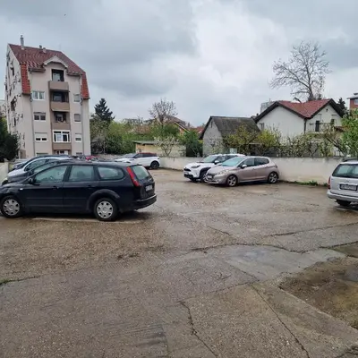 a group of cars parked in a parking lot at iDoli Stan in Belgrade