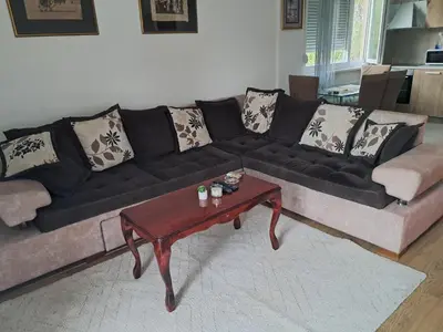 a black couch and a coffee table in a living room at Apartman Palma in Belgrade