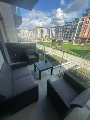 a balcony with couches and a table in a city at Luxury Escape in Belgrade Waterfront in Belgrade