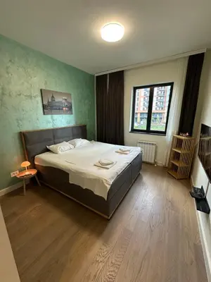 a bedroom with a large bed in a room at Luxury Escape in Belgrade Waterfront in Belgrade