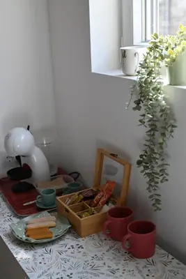 a table with a tray of food and a plant at La Pastorela in Belgrade