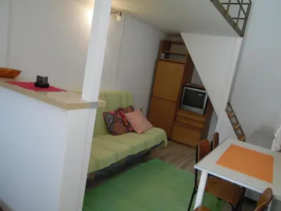 a living room with a couch and a tv at Apartment Angie in Belgrade