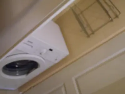 a white washer and dryer in a room at Apartment Angie in Belgrade