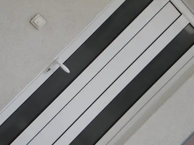 a sliding glass door with black and white stripes at Apartment Angie in Belgrade