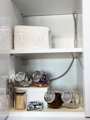 two shelves of a refrigerator with items in it at Limpio Apartman in Belgrade