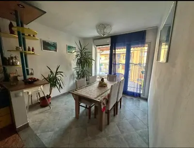 a kitchen and dining room with a table and chairs at Huge Apartment 100sqm in Belgrade