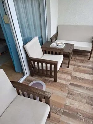 a living room with two chairs and a table at Stan na dan Ub in Ub