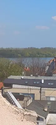 a building with a view of a body of water at Dunav centar 7 in Smederevo