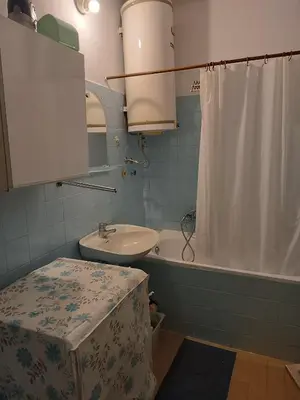 a bathroom with a sink and a toilet and a tub at Dunav centar 7 in Smederevo