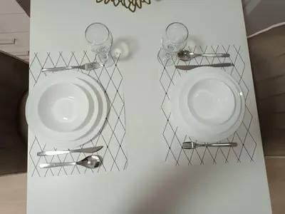 two metal wall mounted plates with glasses on them at Apartment Leona in Inđija