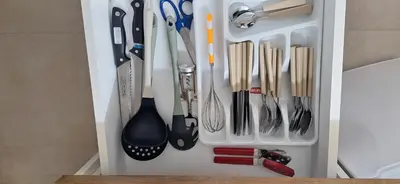 a white refrigerator filled with lots of kitchen utensils at Divna in Arandjelovac