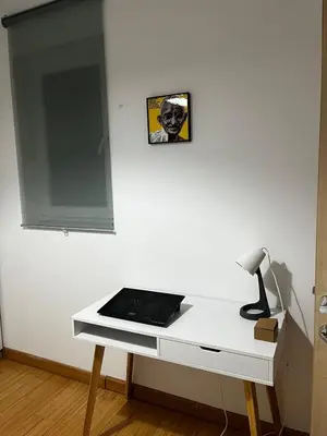 a white desk with a lamp and a laptop on it at City center Dorcol free parking in Belgrade