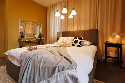 a bedroom with a large bed with white sheets at Creative Shelter 108m2 with Balcony Old Town in Belgrade