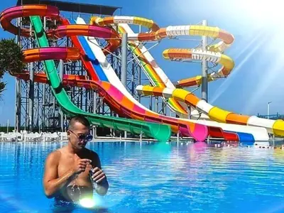 a man in a swimming pool in a water park at Belvedere RESORT in Smederevo
