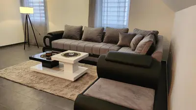 a living room with a couch and a table at Crassula Lux 2 in Surčin