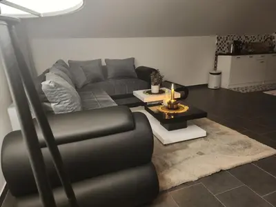 a living room with a couch and a table at Crassula Lux 2 in Surčin