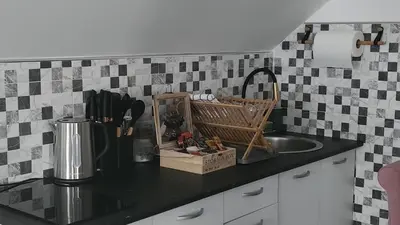 a kitchen with a sink and a counter top with a counter top at Crassula Lux 2 in Surčin