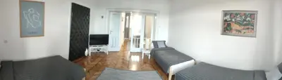 a living room with a couch and a television at Vuk 1 in Belgrade