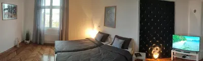 a living room with a couch and a tv at Vuk 1 in Belgrade