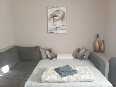 a living room with a couch with a blanket at Beautiful house in Smederevo