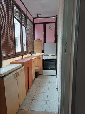 a kitchen with pink walls and a white tile floor at Beautiful house in Smederevo