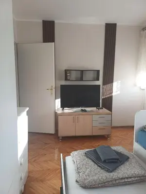 a living room with a flat screen tv on a table at Beautiful house in Smederevo